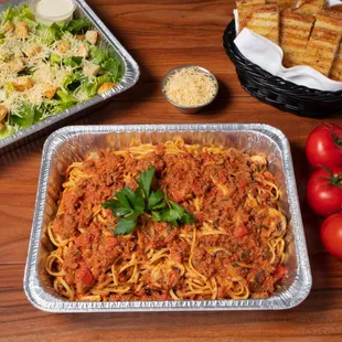 Family Pasta Combo (Linguine Bolognese): Feeds 4-6 and includes 1 pasta, 1 salad, and grilled artisan bread.