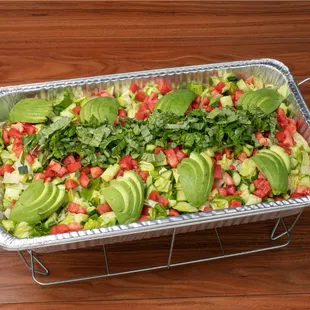 Romaine Avocado Salad Catering Tray: fresh avocado, lettuce, tomatoes, cucumbers and homemade lime dressing