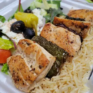 Chicken kabob with rice and Greek salad