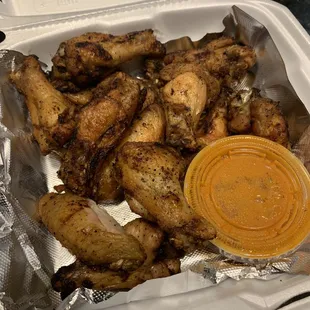 12 piece grilled chicken wings with hot sauce on side