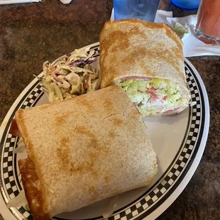 Grinder panini with extra lettuce and side of coleslaw