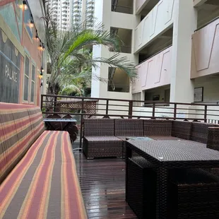 Outdoor bar, on a rainy day still nice and dry for some parts of the bar.