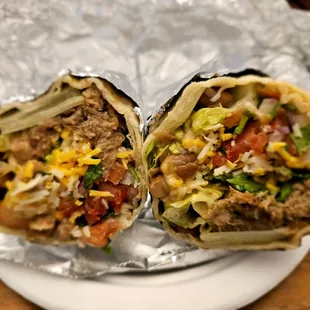 My yummy"Kalua Big" Burrito 7/2/2024. Dinner@Paniolos -Kahala Mall.I just wished that they had *Plastic Knives?*,but da Nice Girl cut it 4me