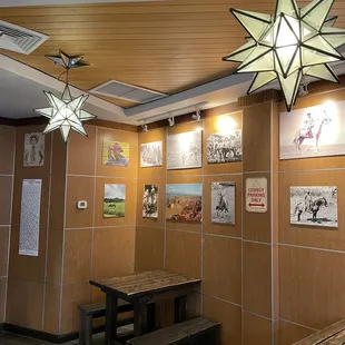 a star - shaped light fixture hanging from the ceiling