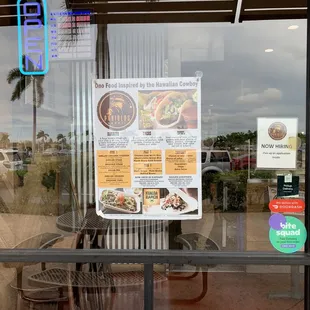 Window with menu - to the left of the  front entrance.