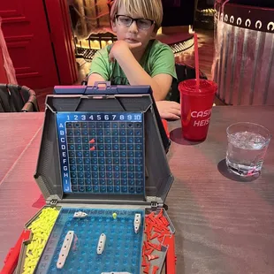 Playing a serious game of battleship over a glass of lemonade