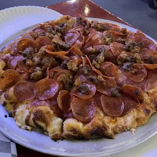 Meat lovers pizza piled with TONS of meat