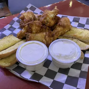 Mild heat flavored chicken wings with ranch and blue cheese dressings