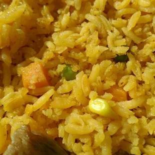 The firm rice with corn, peas and carrots.