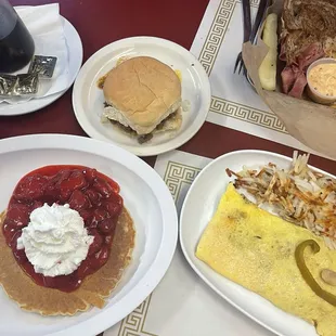 Pancake with strawberry and whip cream topping, Greek burger, pick your own 3 ingredient omelette