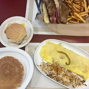 Ruben sandwich with fries and a pepper, mushroom &amp; cheddar cheese omelette