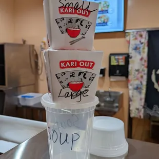 three cups of soup on a counter