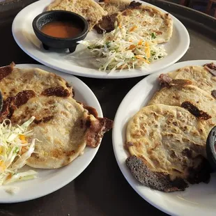 three plates of food on a table