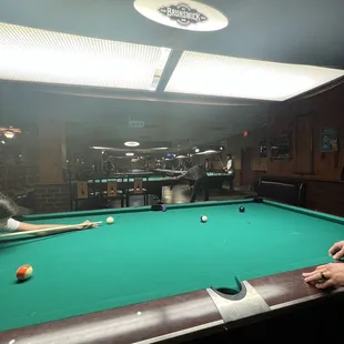 a man playing pool