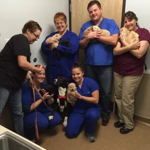 The Gang with a rescued (and pregnant) mama "Lily" and her 8 healthy puppies.