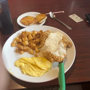 Scrambled Eggs with Chicken Fried Steak and an English Muffin