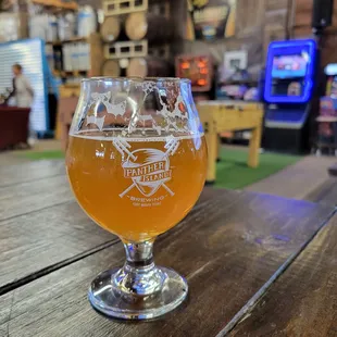 a glass of beer on a table