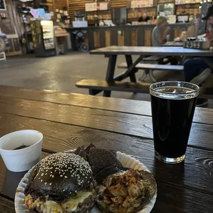 a plate of food and a glass of beer