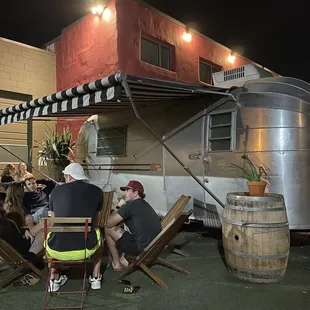 a group of people sitting around a table