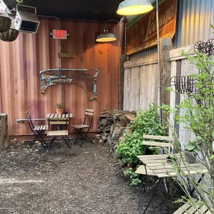 a patio area with chairs and tables