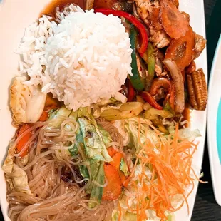 a plate of food with rice and vegetables