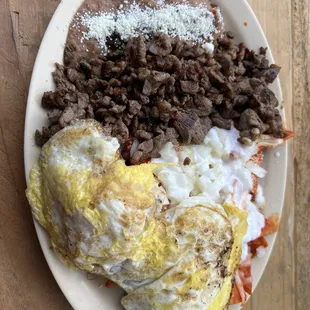 Chilaquiles Rojos with asada (I forgot the official name of the plate but it&apos;s gas)