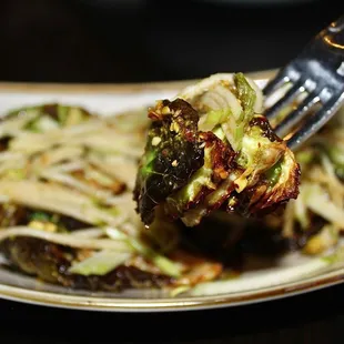 The Cavolini Di Bruxelles are fried brussels sprouts served with apple cider reduction, pistachio, rosemary salt &amp; sliced green apple.