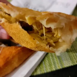 Artichoke hearts, mozzarella, and pecorino ronano. Very tasty.