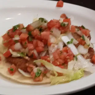 a plate of food with a fork and spoon