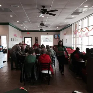 a group of people sitting at tables