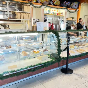 a woman standing in front of the counter