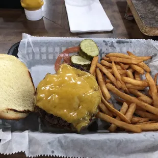 Cheeseburger with fries Lots of yummy pickles!