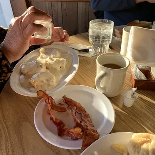 Biscuits and gravy with a side of bacon