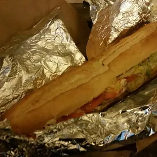 a sandwich wrapped in foil
