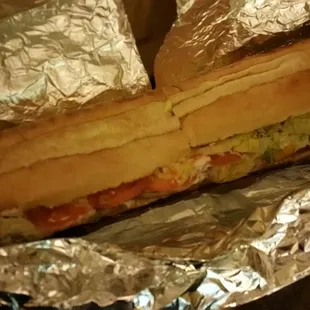 a sandwich wrapped in foil