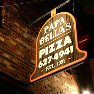 a sign for papa bella&apos;s pizza
