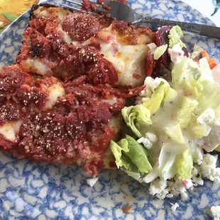 a slice of pizza and a salad