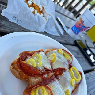 Pizza sub with loaded tots
