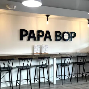 a bar with stools in front of it