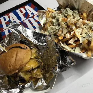 Papa Dads burger and wing fries. .