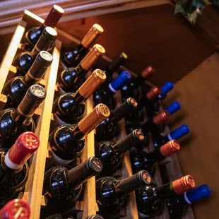 a wine rack full of wine bottles