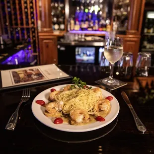 a plate of pasta and shrimp