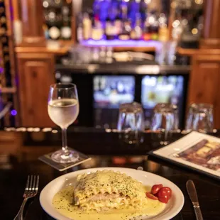 a plate of pasta and a glass of wine