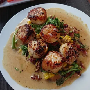 Scallops a bit over cooked and sauce is too watery. One of the scallop has sand.