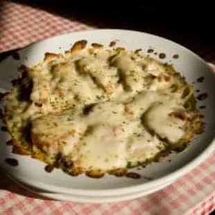 Baked Nebraska!  Spaghetti with loads of meat, and cheese.  Red sauce on one half, white sauce on the other.