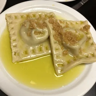 Huge ravioli is garlic and olive oil