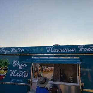 a man ordering food from a food truck