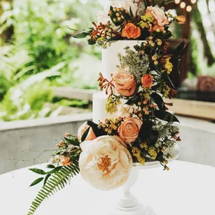 Family friend added the flowers. Flowers NOT by Papa Haydn, but the smooth cakes and stand are by Papa Haydn! So happy with the result