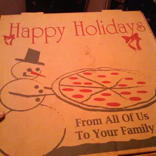 a pizza box with a snowman drawn on it