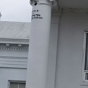 There is a cannon ball trapped in the building across the street. This is a civil war cannon ball.